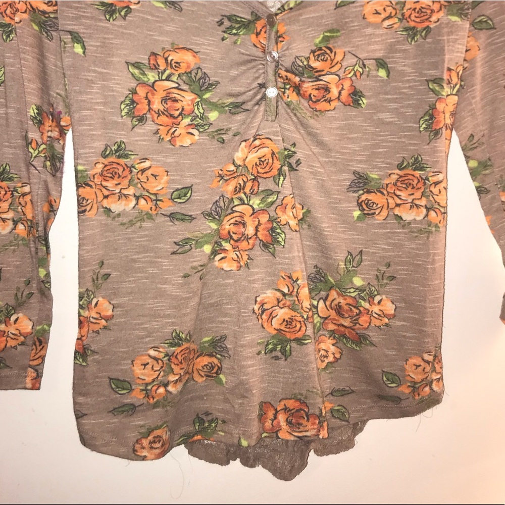 A brown v neck half sleeve shirt